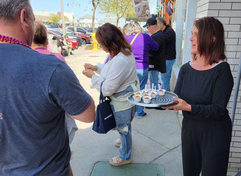 Tracy Worley was handing out a fried gumbo fritter from Federal Fritter. The fritter contained the substance of the gumbo and was then placed into the broth.
